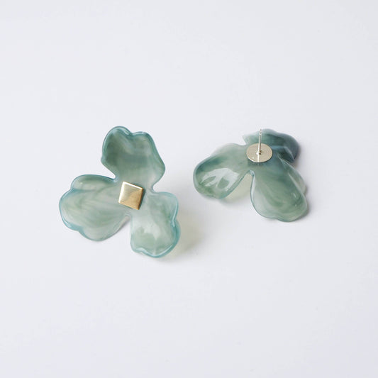 Oversized green floral acetate earrings with polished gold-tone centre