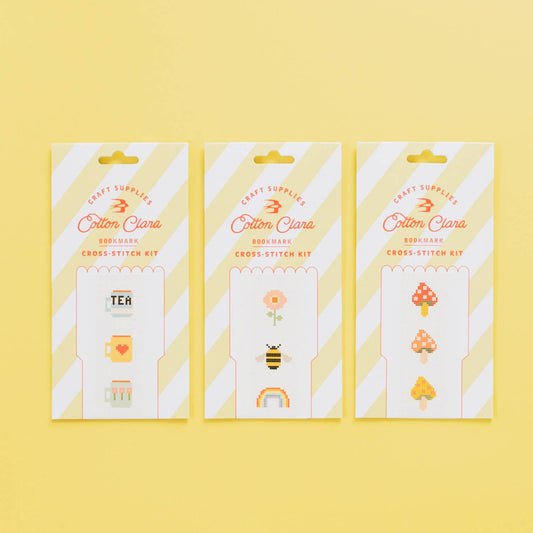 Close-up of unprinted white Aida fabric and colourful embroidery threads