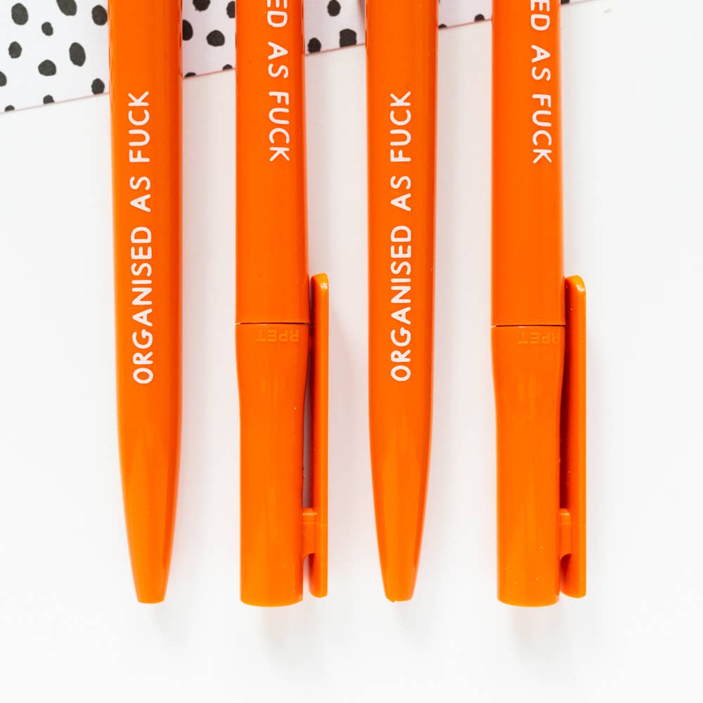 Orange eco ballpoint pen reading ‘Organised As Fuck’, twist-top with clip, recycled plastic barrel, black ink refill.