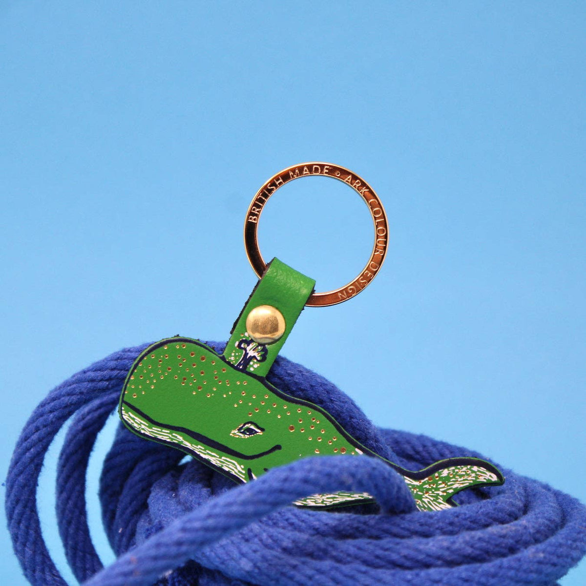 Handmade leather humpback whale keychain packaging and product
