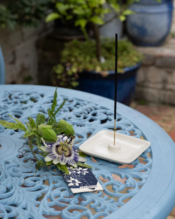 Luxury incense sticks in eco-friendly recycled paper packaging with botanical hand screen-printed design, handmade in India by disabled artisans.