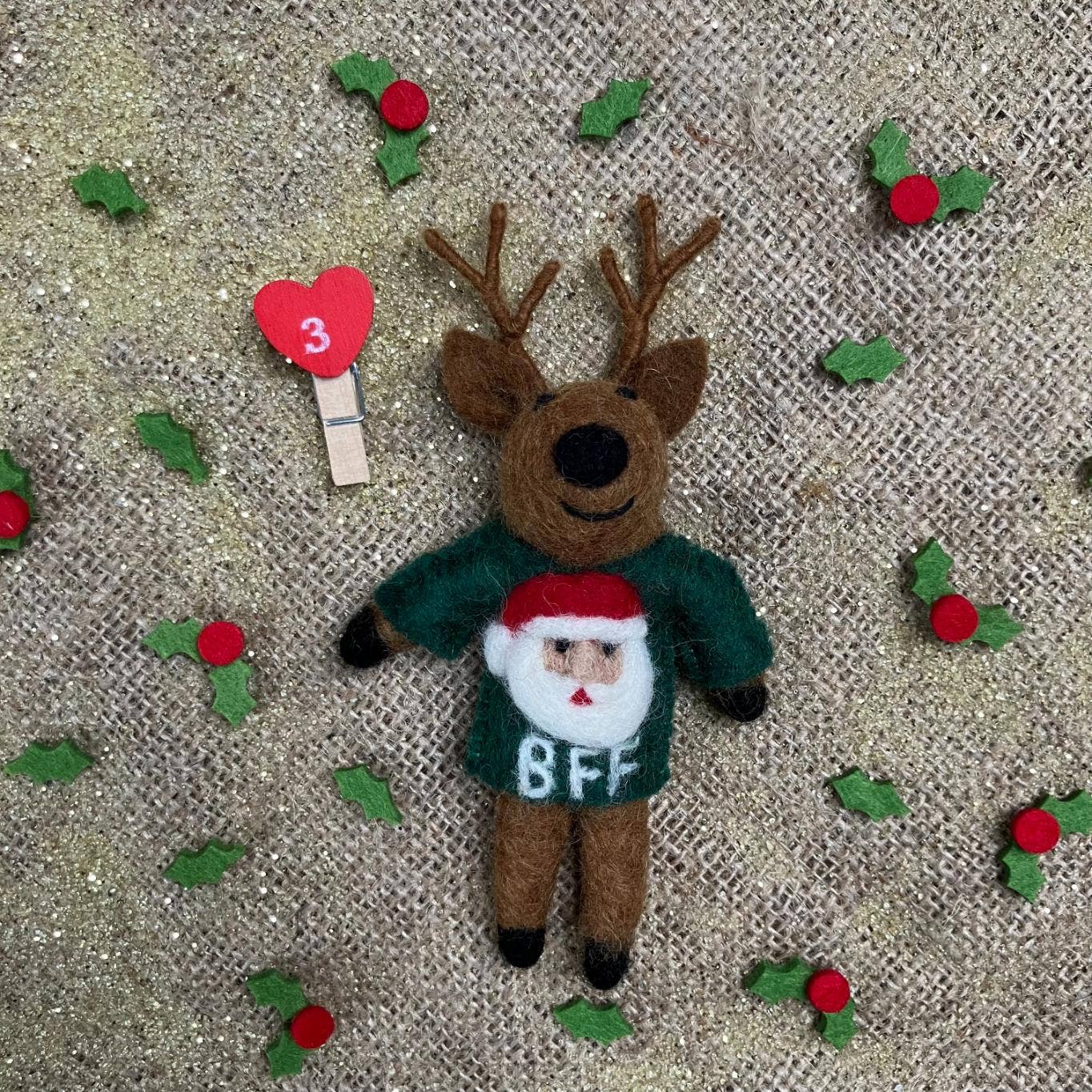 Handmade felt BFF Reindeer hanging Christmas decoration by Felt So Good, sustainable wool with green jumper featuring Santa face and BFF sentiment, eco-friendly