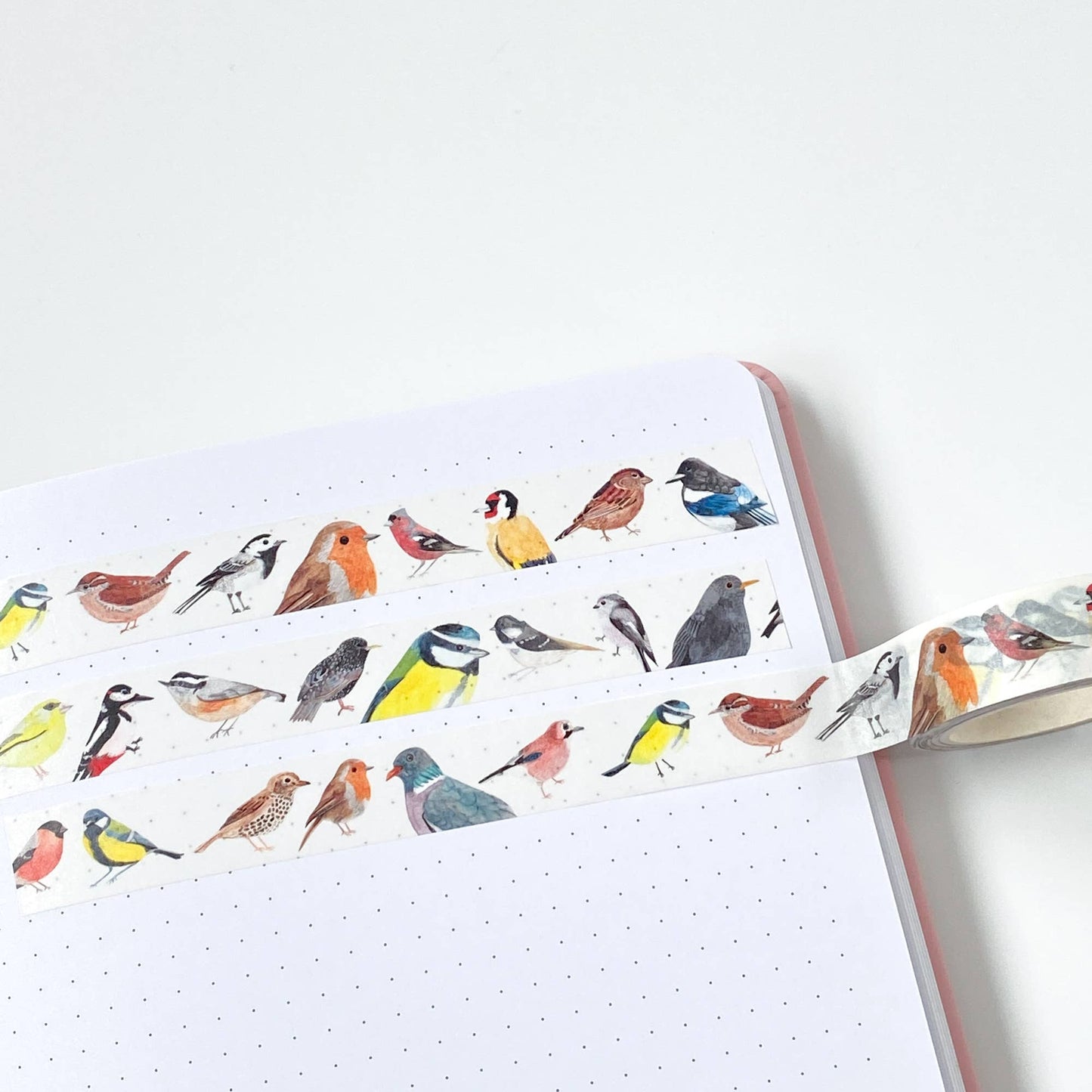 Close-up of British Birds Washi Tape featuring original watercolour bird illustrations on a white background, 10 metres long. Eco-friendly craft tape.