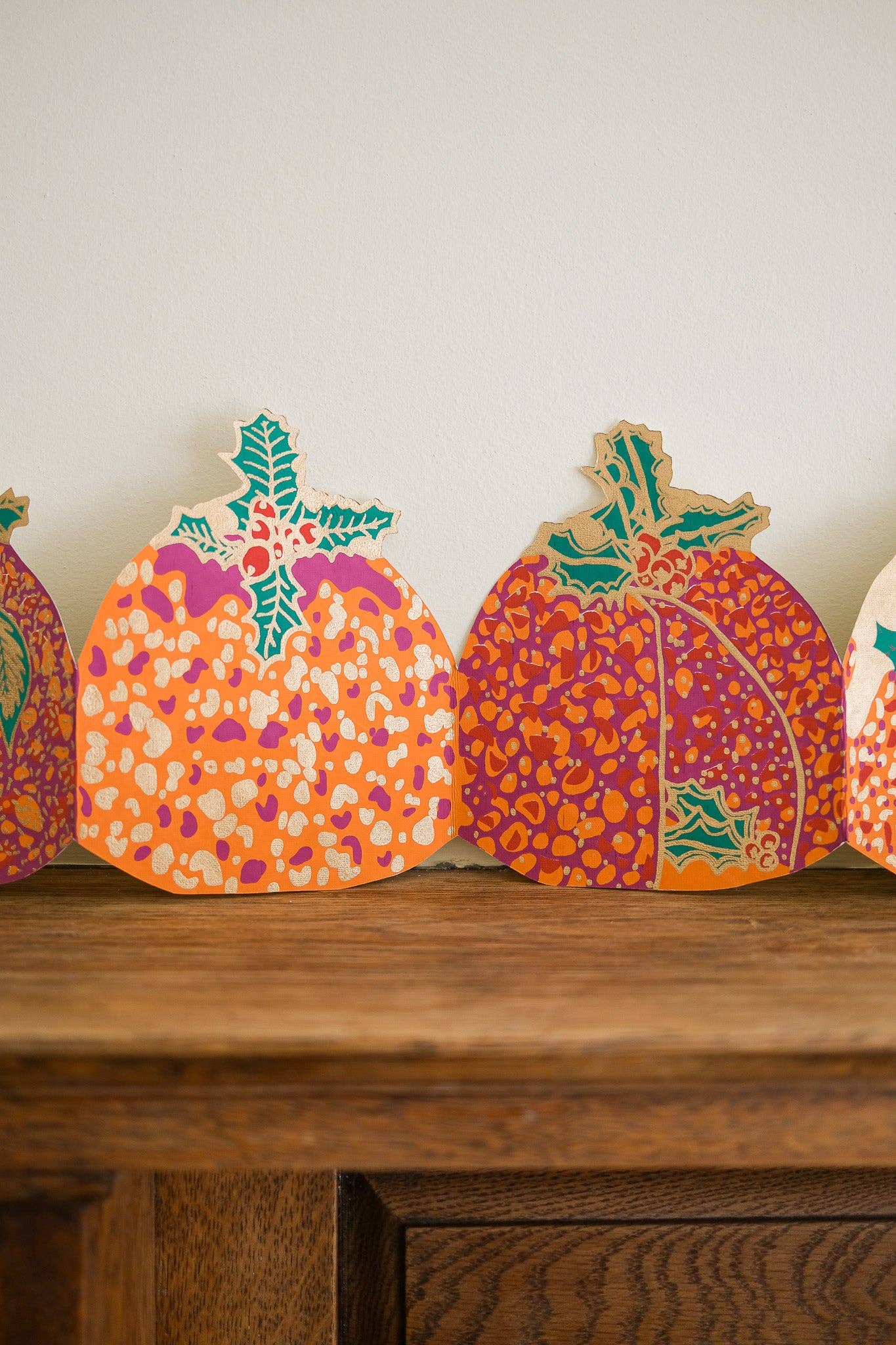 Hand-printed recycled paper Christmas Puddings Concertina Garland by East End Press, 3 metres long