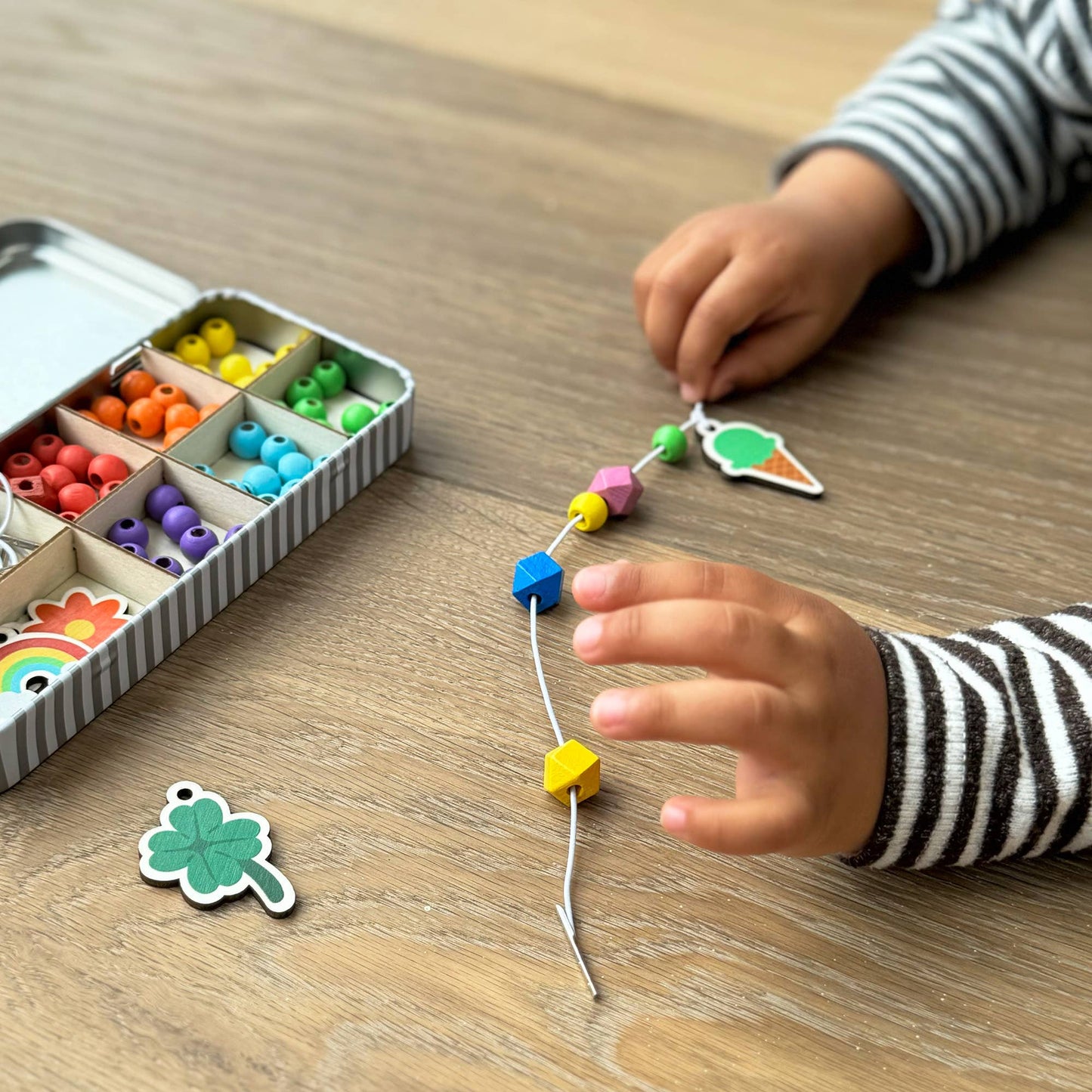 The Lucky Dip Keyring making kit is a wonderful plastic free activity. It offers a selection of wooden fobs to include a clover, flower, starfish, ice cream & a rainbow, allowing children to create 5 keyrings. The kit also comes with rainbow coloured spacer geometric beads to complement the showpiece beads for vibrant accessories!