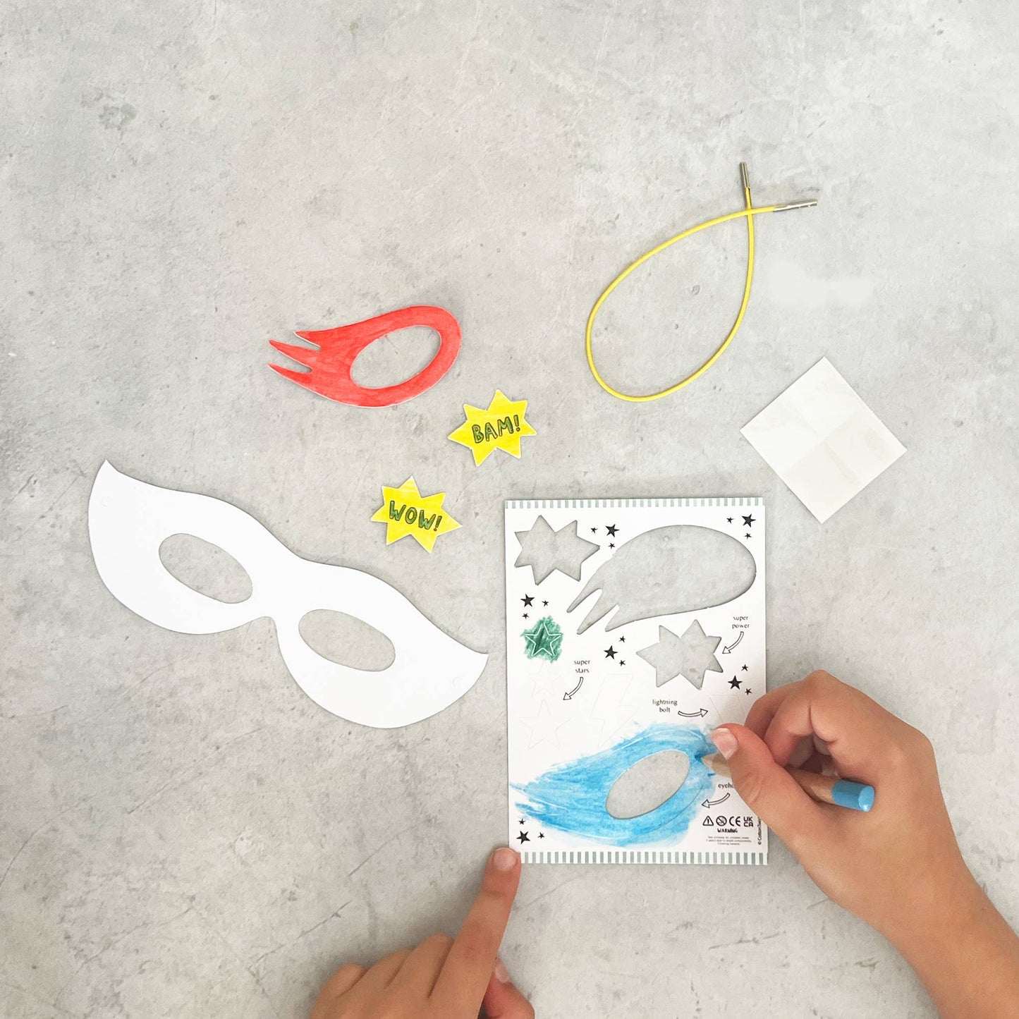 Children can use the mask base & cut-outs to embellish their masks and create their favourite superhero mask. Colour in your mask & accessories, attaching them with the glue dots, then it's time to show family & friends your special powers!