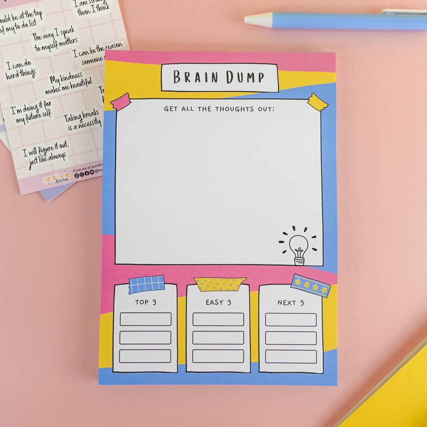 A5 Brain Dump Notepad by Sunshine Lane—lined pages with ‘Top 3’, ‘Easy 3’, ‘Next 3’ tasks section, 120gsm paper.