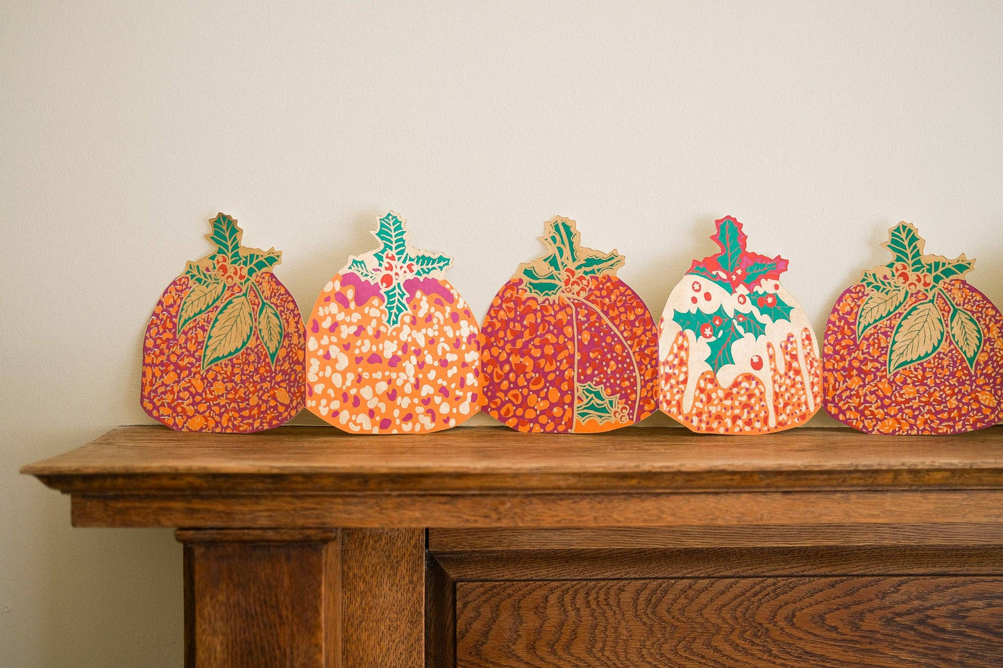 Hand-printed recycled paper Christmas Puddings Concertina Garland by East End Press, 3 metres long