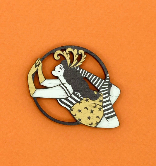 Vintage style wooden circus aerialist pin brooch with feather headdress from Night Circus collection by Su Owen, made from sustainable walnut wood, lasercut in the UK.