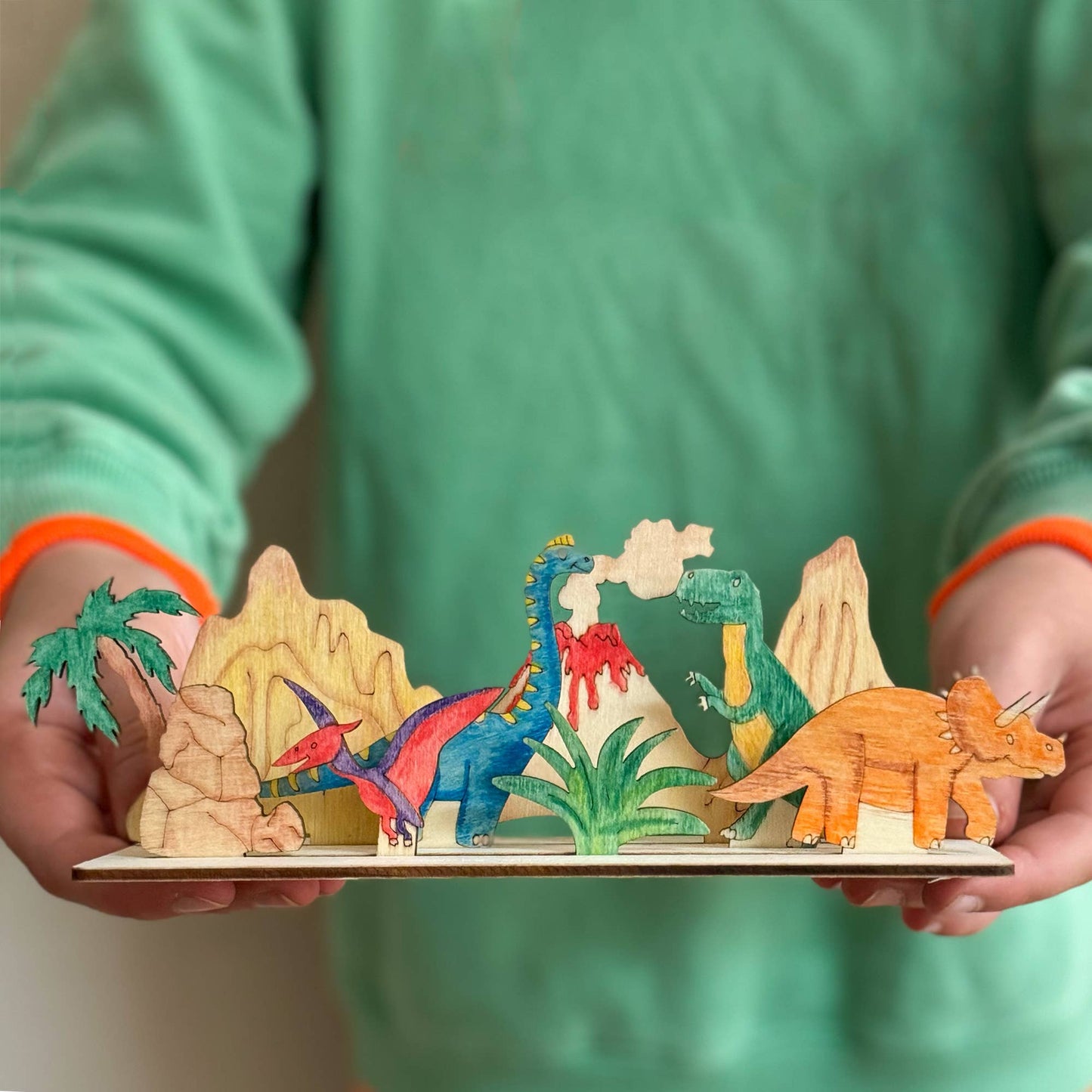 This craft kit is perfect for those who love to be creative, those who love dinosaurs (who doesn't!). Inside, discover a collection of wooden pieces, each intricately designed to spark creativity, including the mighty T-Rex, a triceratops, pterodactyl and a brachiosaurus. With wooden parts of all your favourite dinosaurs, plus scenery, the watercolour pencils & paintbrush included allow for detailed ; precise painting with the ability to mix colours. Once painted, simply add the wooden parts