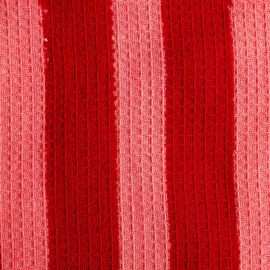 Close up of hand-block printed crimson stripe tea towel