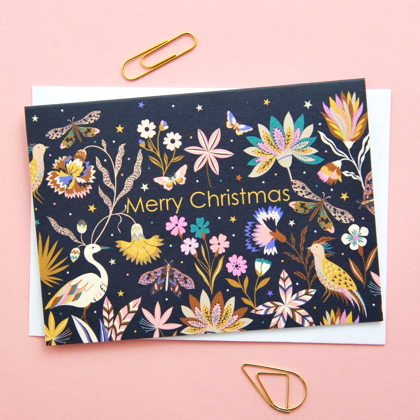 Festive Christmas notecard with colourful flora and fauna illustration on a dark background, 'Merry Christmas' text.
