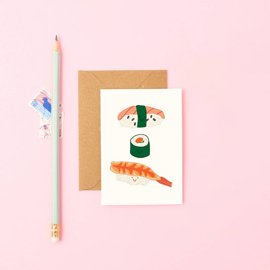 Hand-drawn Mini Sushi Card with prawn nigiri, salmon nigiri, maki roll, and Kraft envelope. Sustainably printed in UK by Forget Me Not & Green.