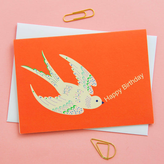 Close-up of orange Happy Birthday bird notecard, UK-printed