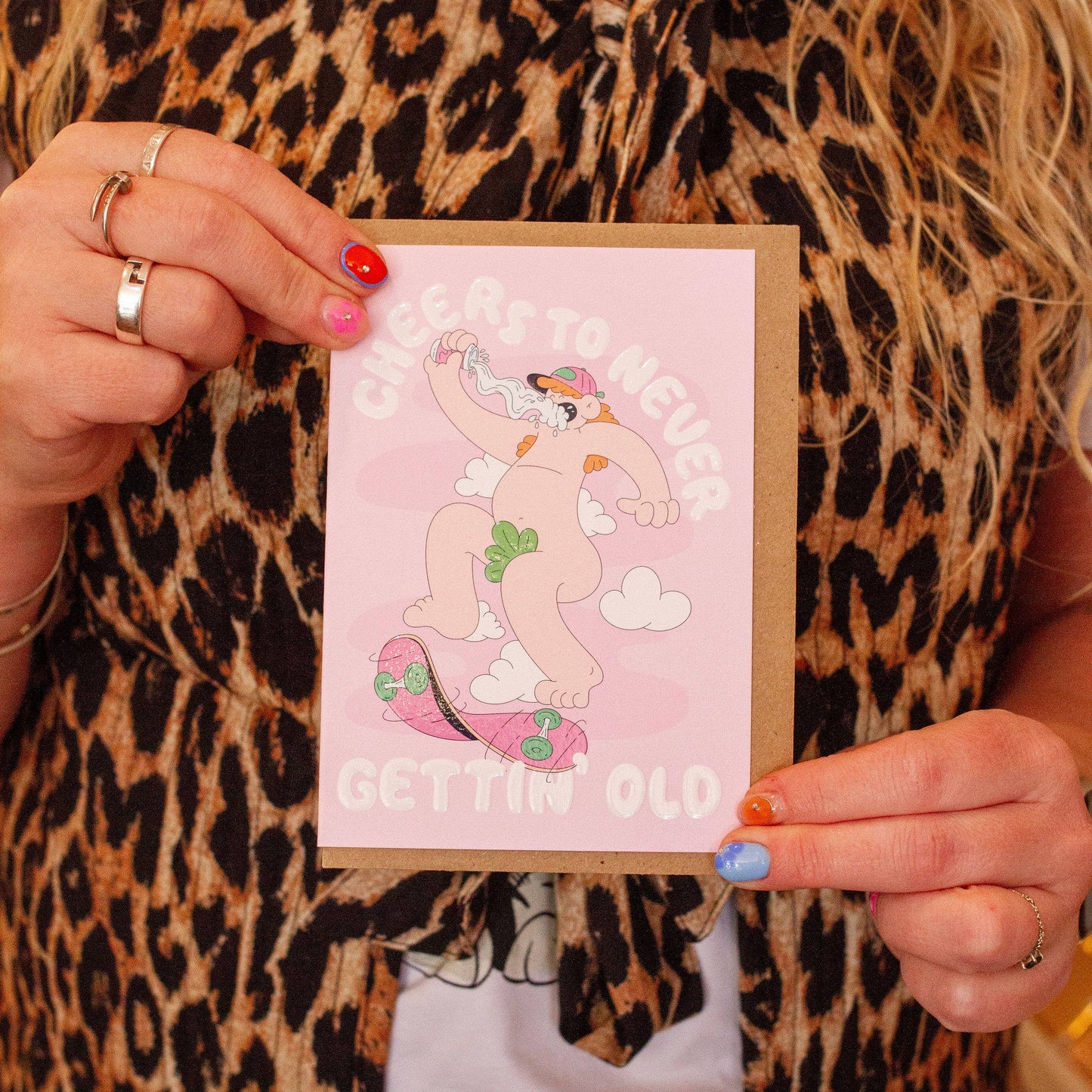 Colourful “Never Growin Up” birthday card featuring pop-art skateboard design, foil accents, textured finish, UK made.