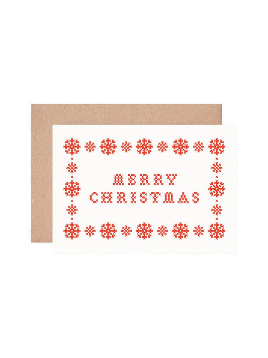 Close-up of screen printed red folk art lettering on Christmas card
