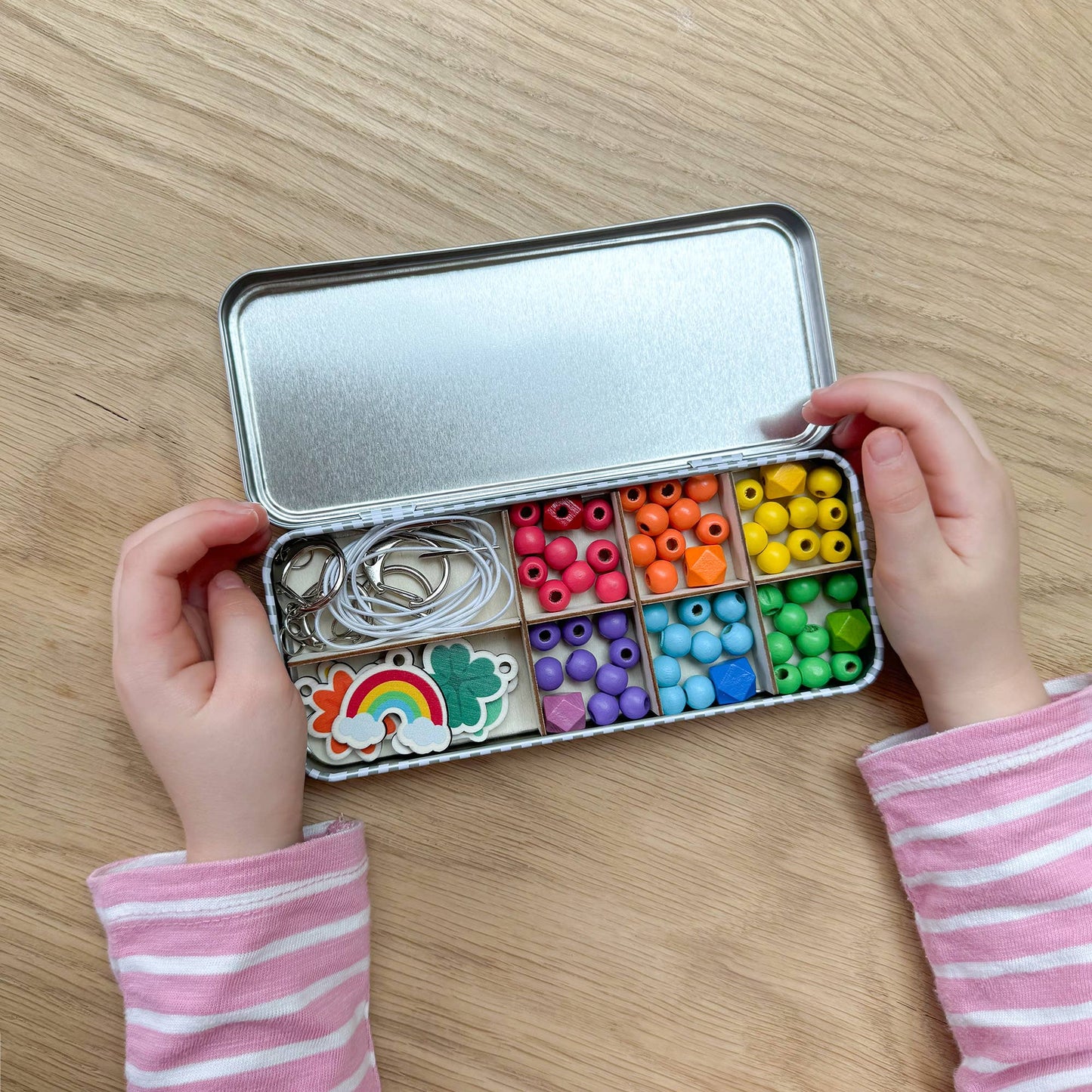 The Lucky Dip Keyring making kit is a wonderful plastic free activity. It offers a selection of wooden fobs to include a clover, flower, starfish, ice cream & a rainbow, allowing children to create 5 keyrings. The kit also comes with rainbow coloured spacer geometric beads to complement the showpiece beads for vibrant accessories!