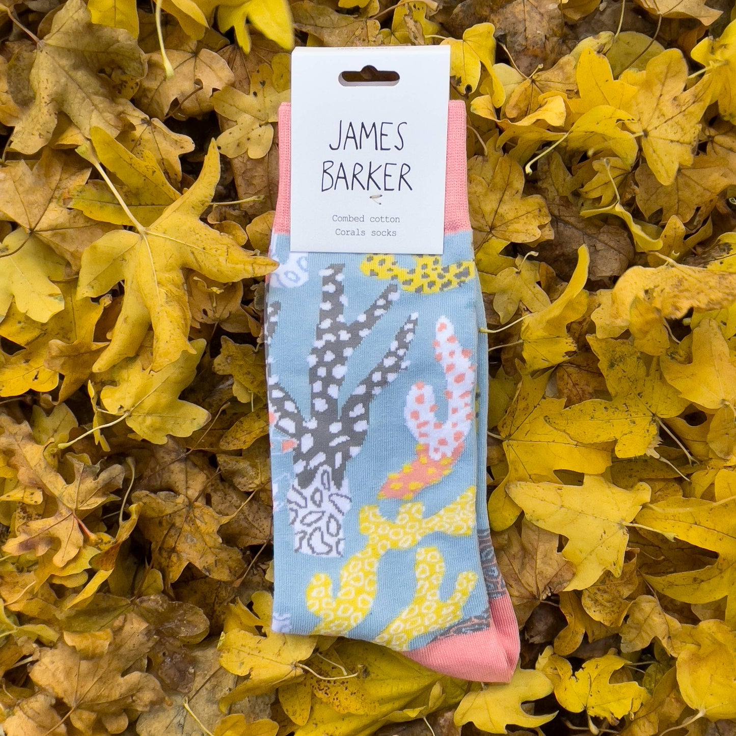 Hand-illustrated coral cotton socks by James Barker—unisex, colourful, playful coral design, bold accessory for ocean lovers.
