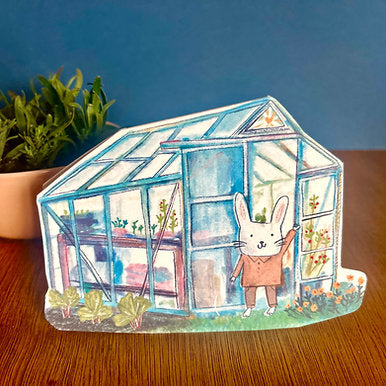 Gardening bunny inside a greenhouse on a recycled greeting card with illustrated envelope, by Laura Skilbeck. Handmade in England.