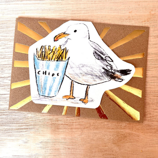 Full view of seagull and chips die-cut greeting card with recycled kraft envelope, handmade in England
