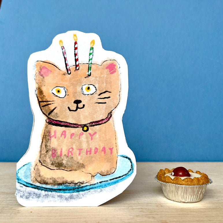 Cute cat birthday cake illustration on a die-cut card with candles, handmade in England on recycled card.