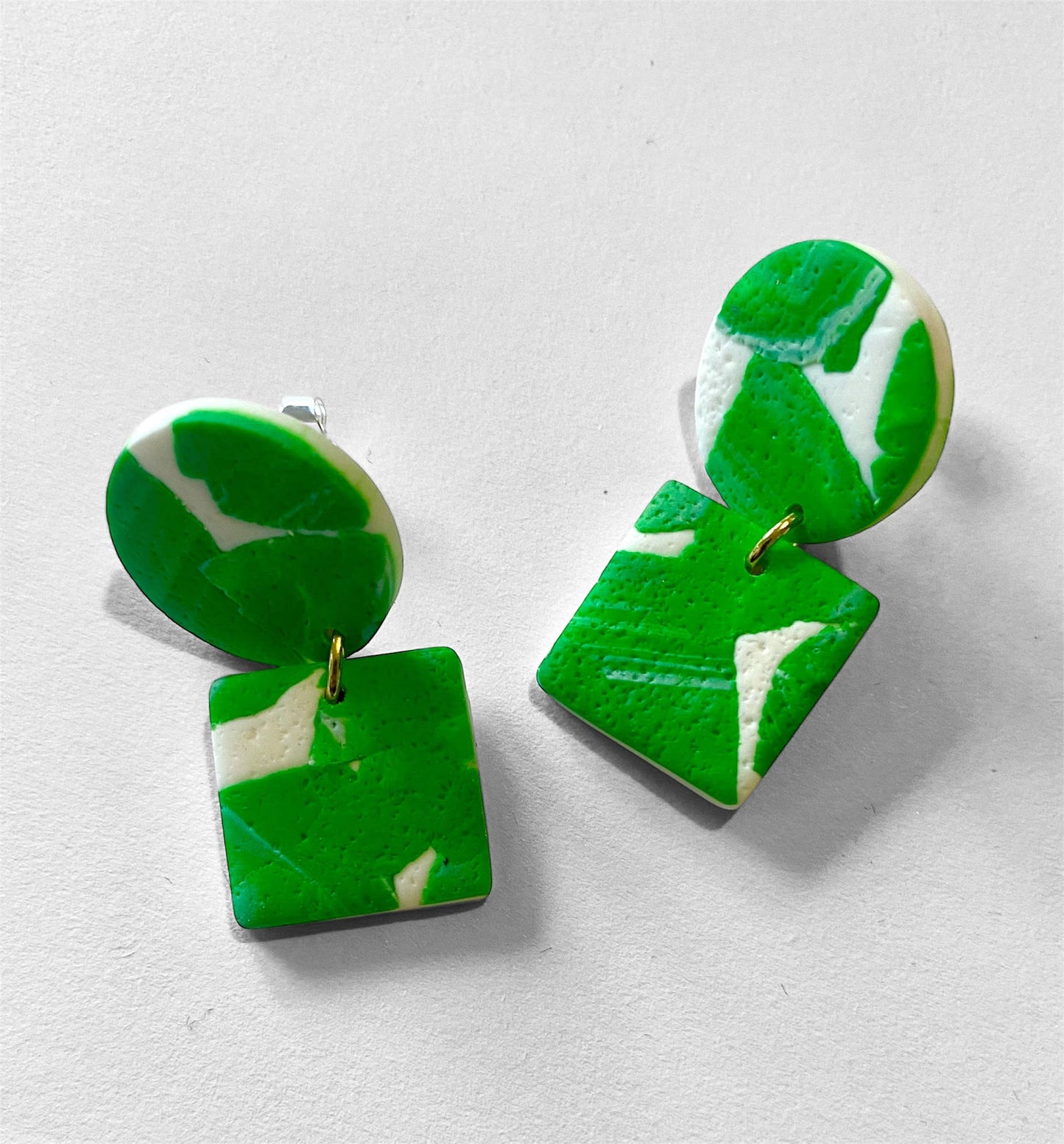 Textured green and white polymer clay earrings with botanical design, silver-plated nickel-free hooks, handmade and lightweight, 3.5cm drop.