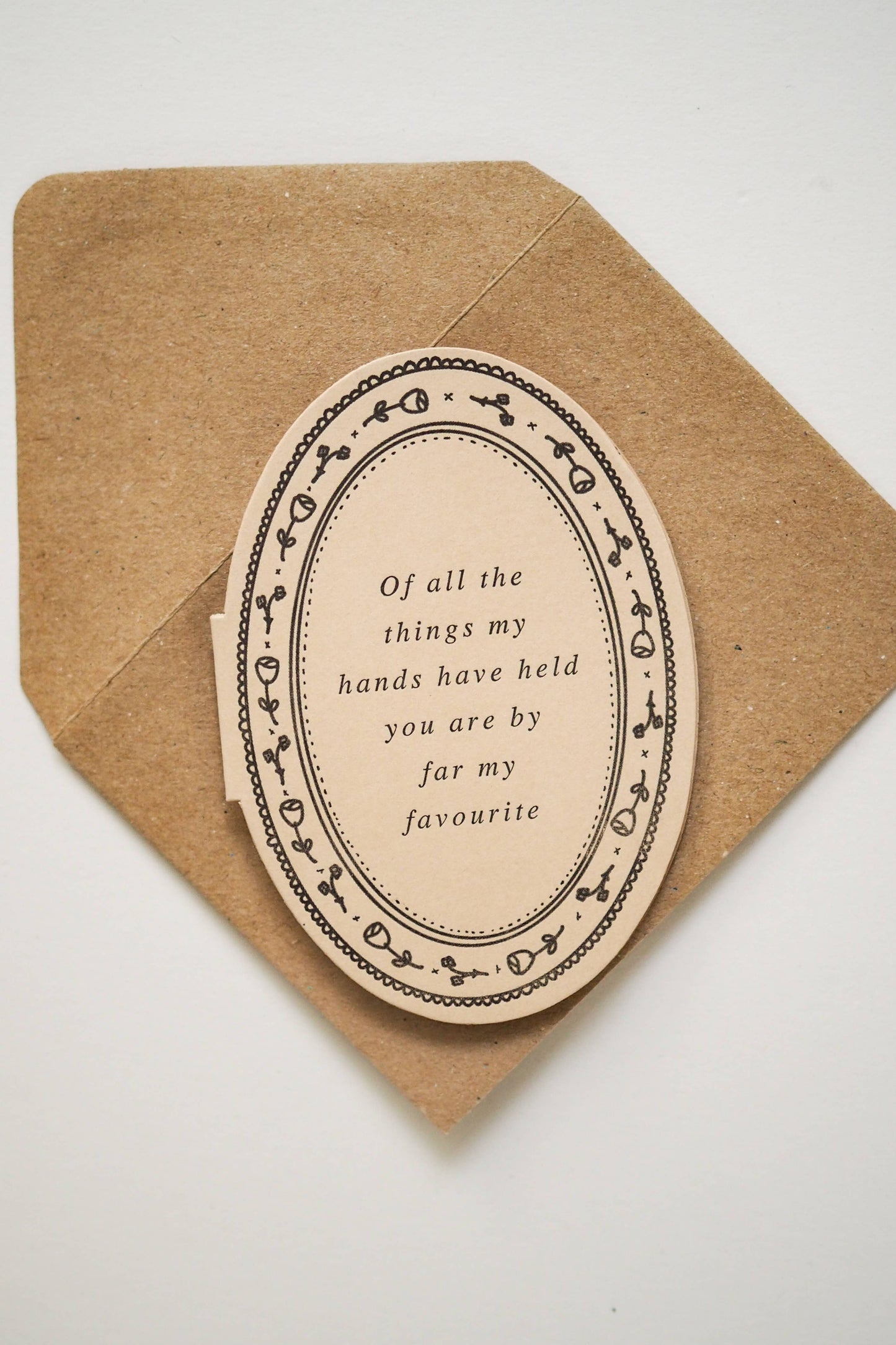 Die cut mini card by Soch & Co., featuring poem “Of all the things my hands have held you are by far my favourite”, letterpress, original illustration, envelope.