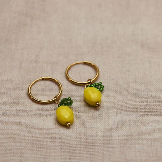 Pair of Gold Plated Lemon Drop Hoop Earrings on display