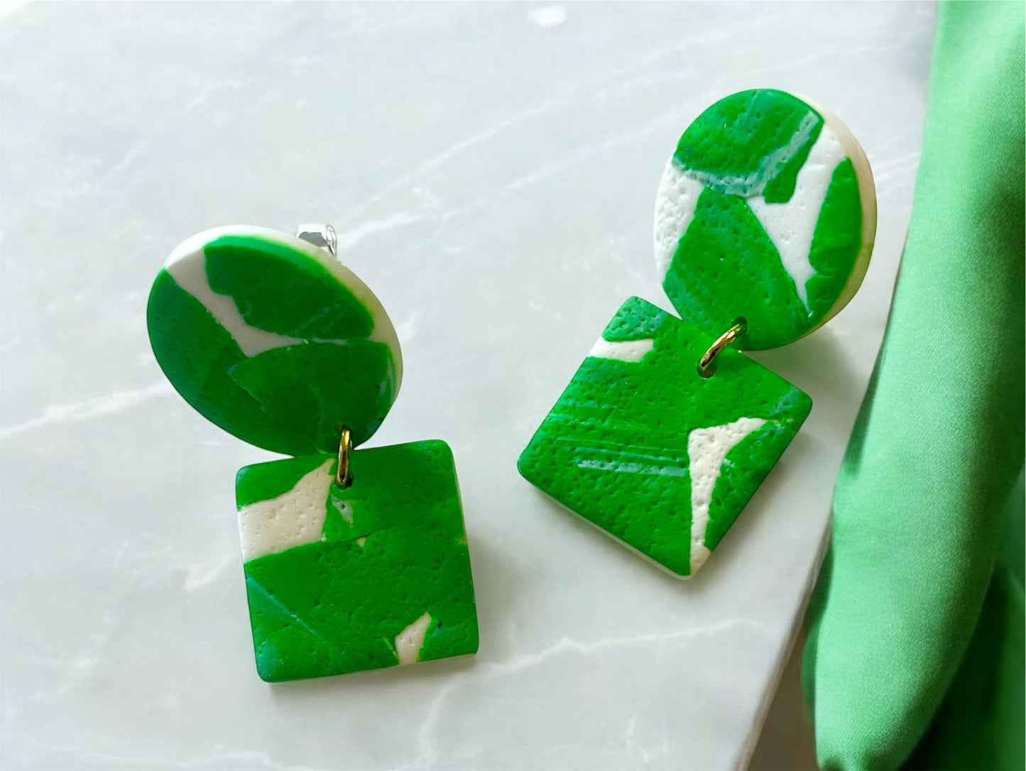 Textured green and white polymer clay earrings with botanical design, silver-plated nickel-free hooks, handmade and lightweight, 3.5cm drop.