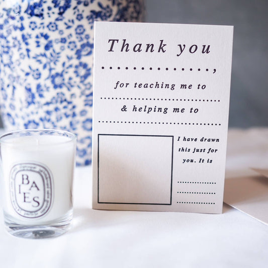 Hand drawing a picture on a blank space of an eco-friendly thank you letterpress card by soch & co.