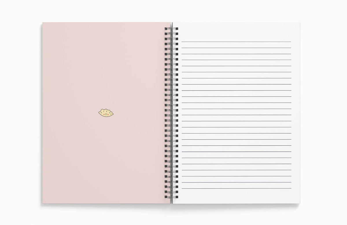 Detailed view of the gyoza design on a textured notebook cover