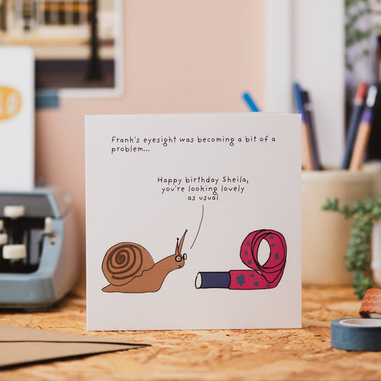 Sheila Snail greeting card showing premium 300gsm card, recycled envelope, and biodegradable sleeve.