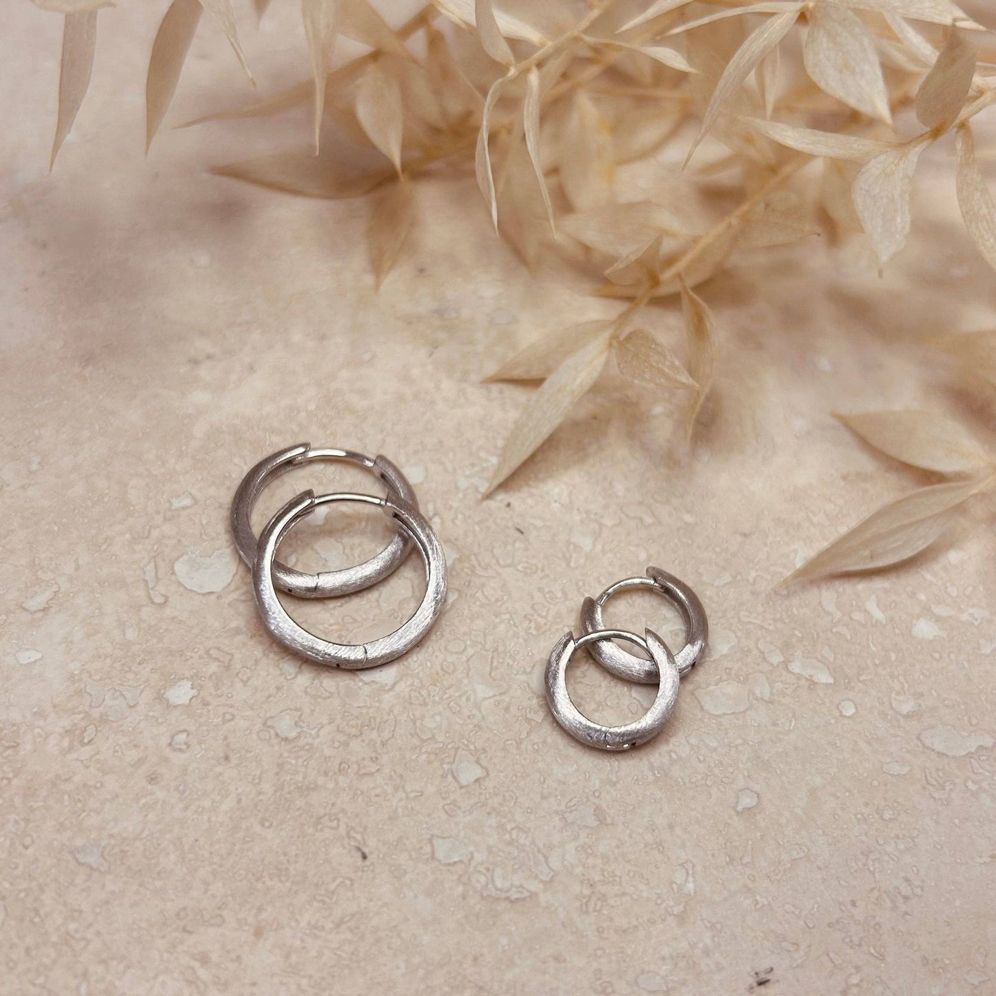 Close-up of Brushed Silver Minimal Hoops with Hinged Fitting