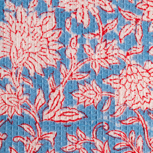 Detail of olive and ivory floral block print on waffle cotton