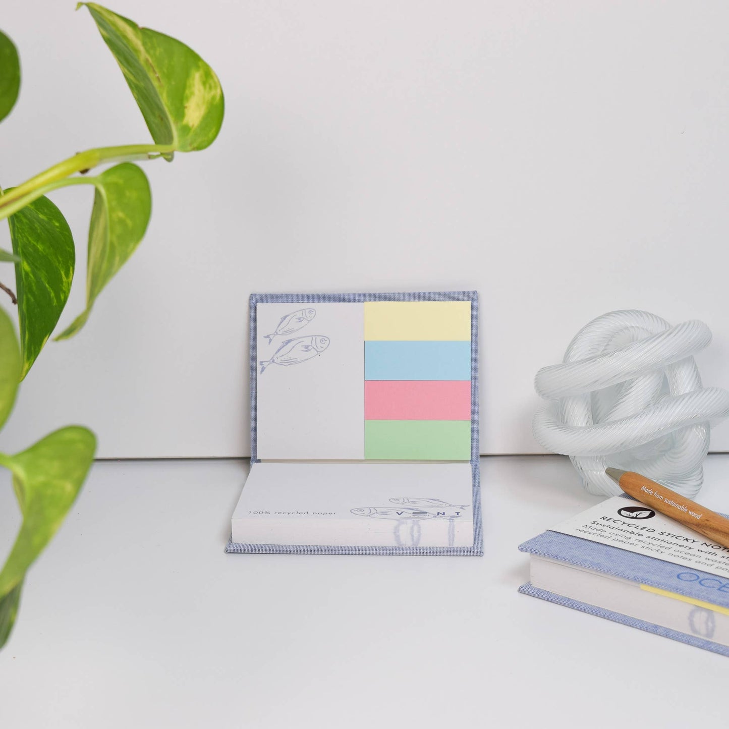 Close-up of the Ocean Blue Sticky Notes Pad cover, highlighting recycled plastic texture and debossed detail