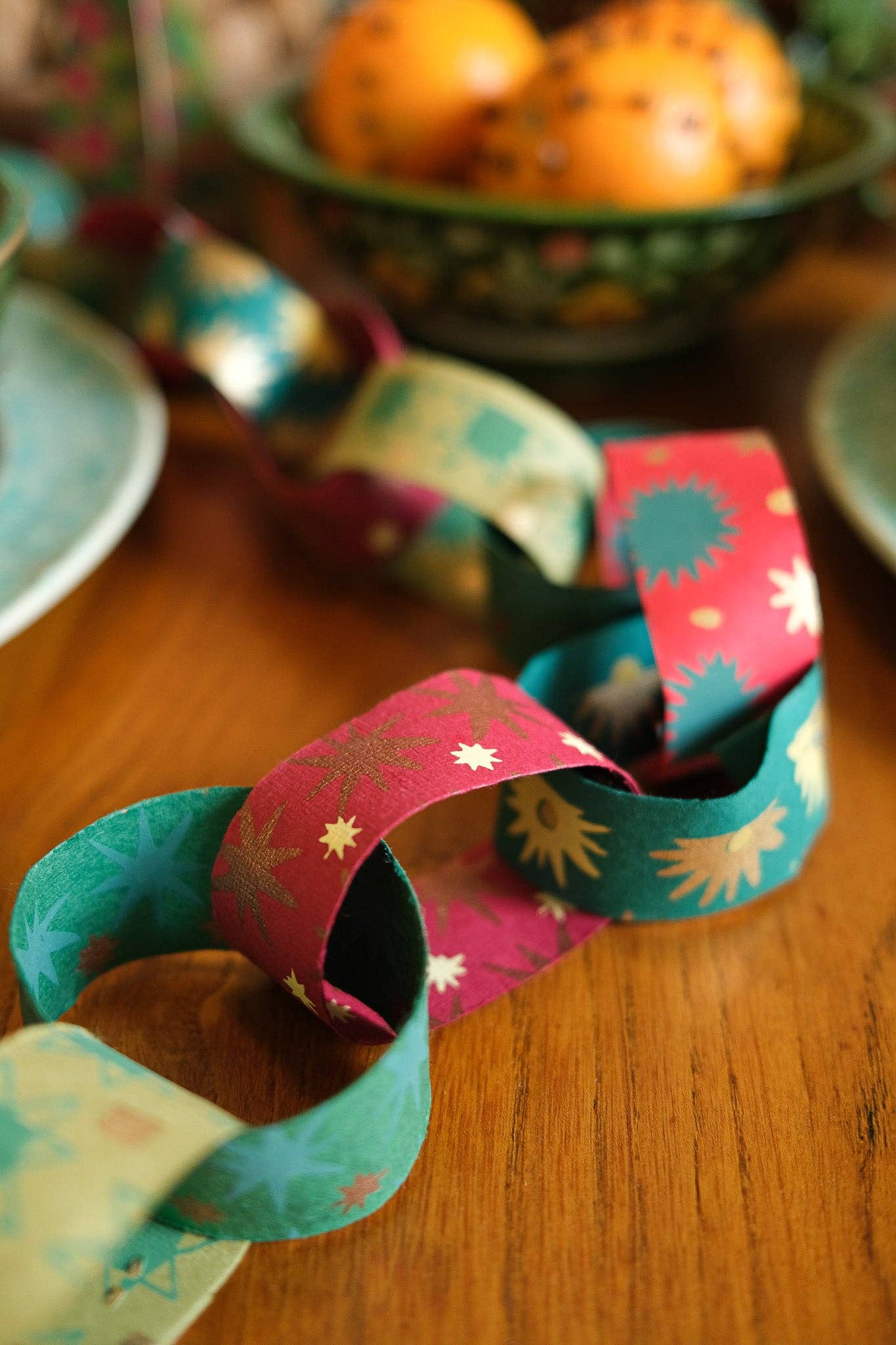 Recycled festive paper chain strips, hand-printed double-sided, eco-friendly decoration kit.