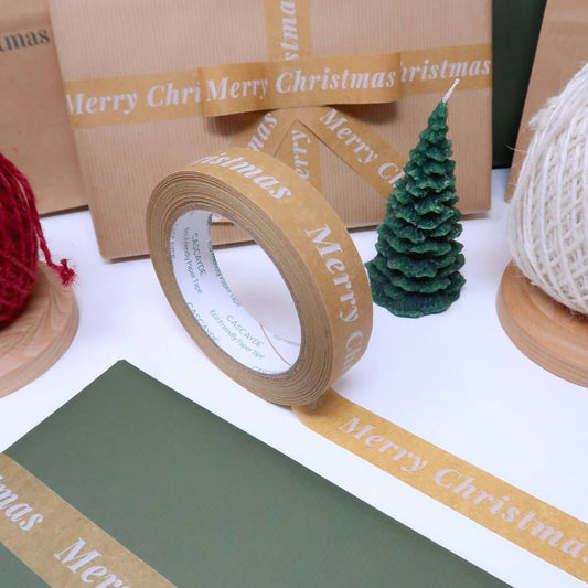 Merry Christmas Paper Tape, 24mm wide 50m roll, plastic-free recyclable kraft, vegan plant-based adhesive, eco-friendly holiday gift wrap tape.