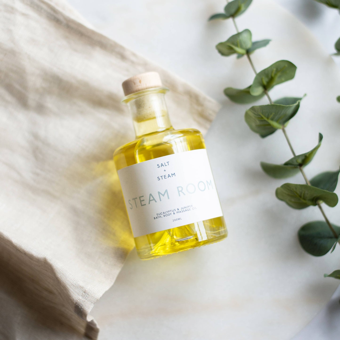 Steam Room eucalyptus juniper oil used for massage, bath, and daily skin hydration.
