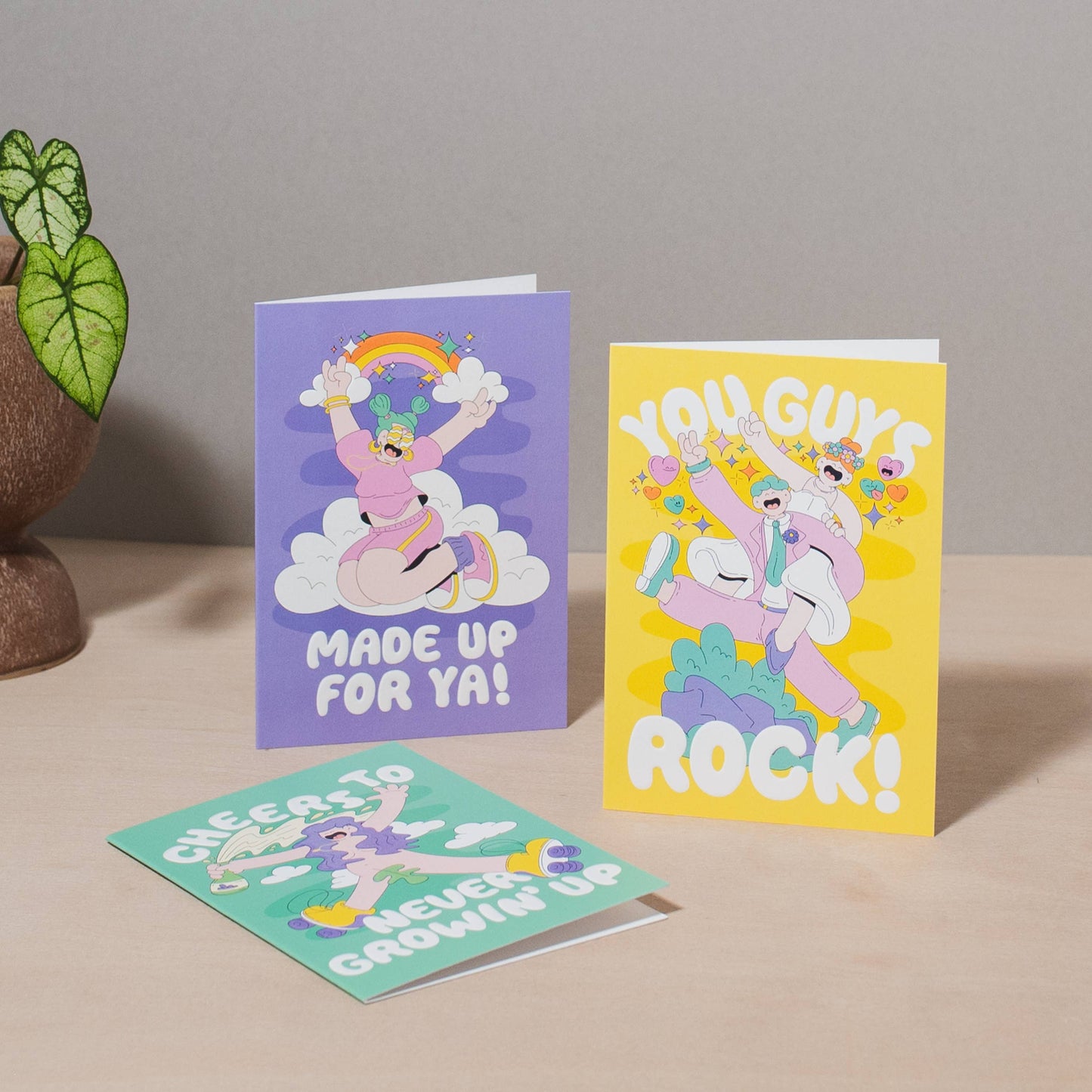 Colourful “Never Growin Up” birthday card featuring pop-art skateboard design, foil accents, textured finish, UK made.