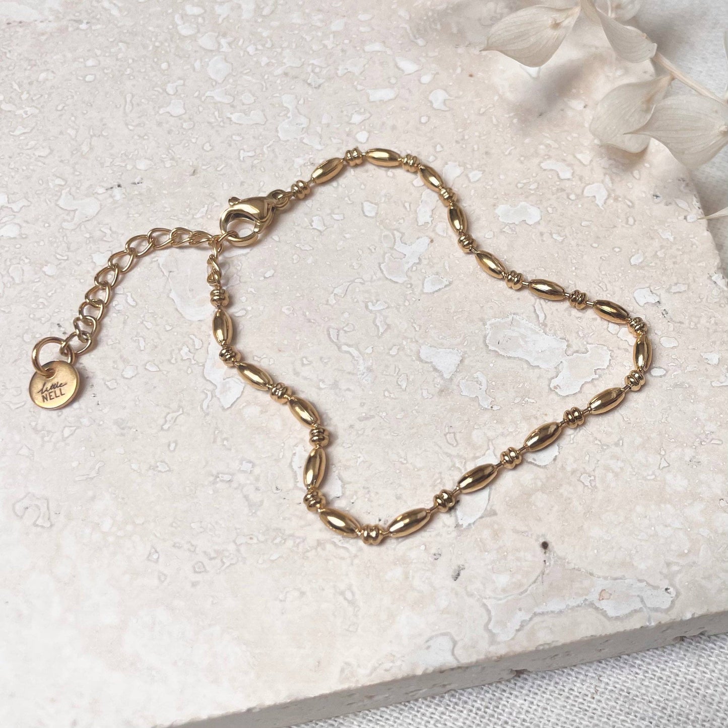 Elegant 18k gold plated bead chain bracelet on a woman's wrist