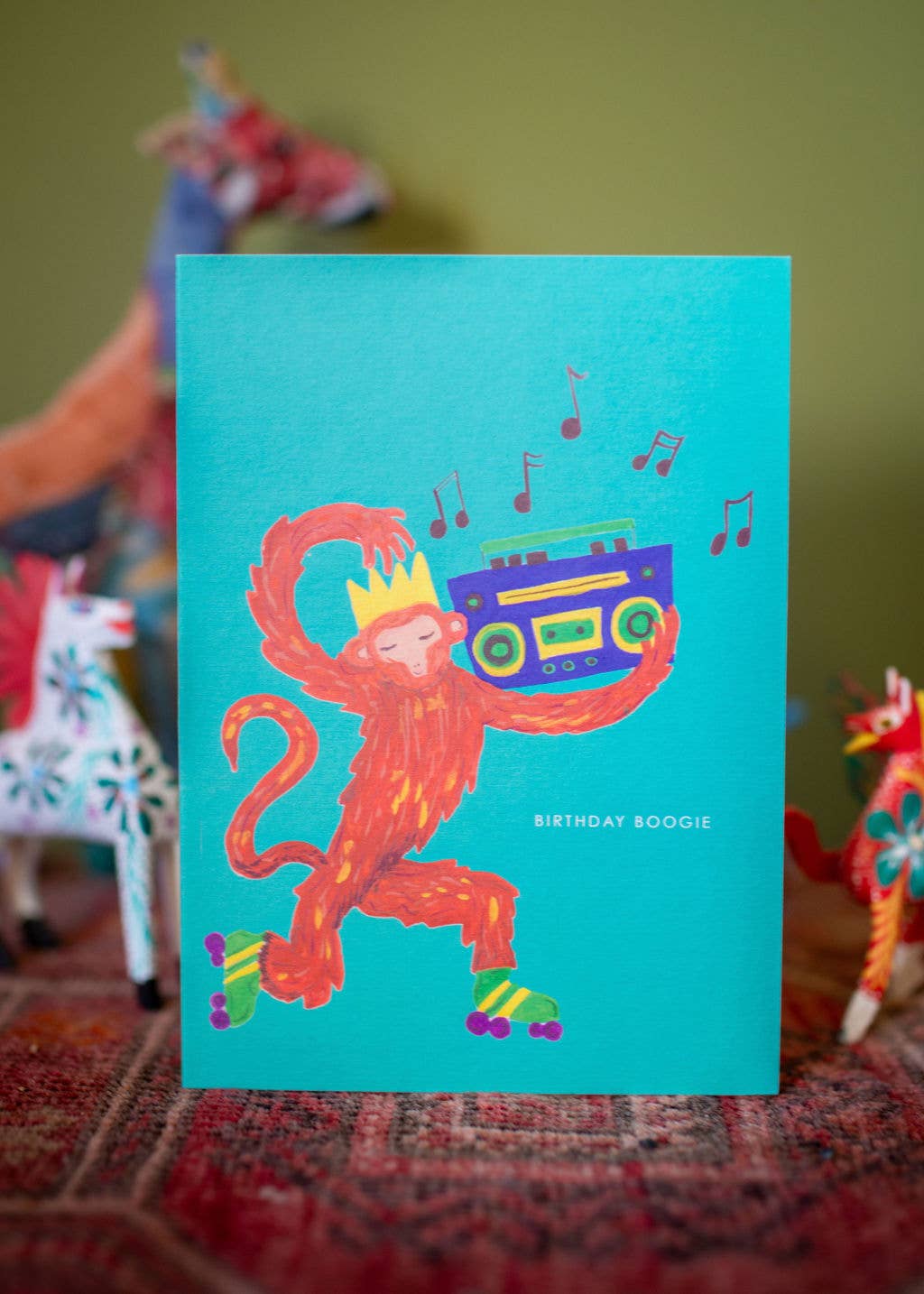 Hand-illustrated musical monkey on roller skates, “BIRTHDAY BOOGIE” text, 5x7” birthday card, UK made, with recycled kraft envelope, sustainable.