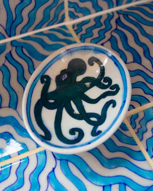 Close-up of hand-painted ceramic soap dish, intricate patterns, natural materials, sustainable homeware accent.