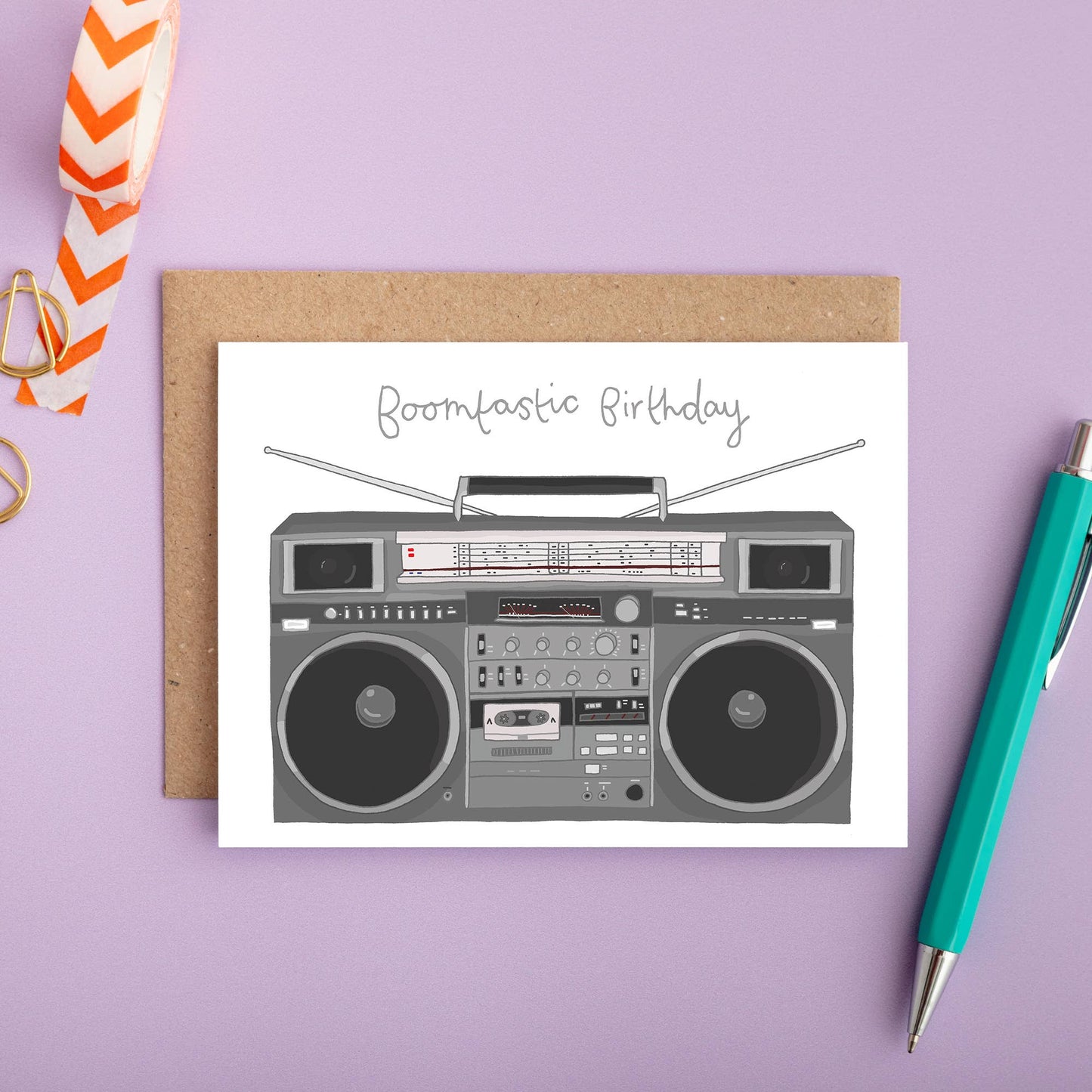 Hand Holding Boomtastic Birthday Card with Retro Boombox