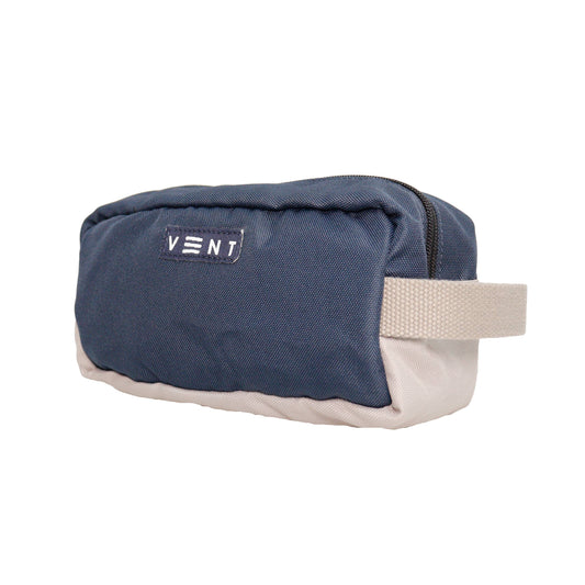 Zip-top closure detail on navy recycled plastic pouch