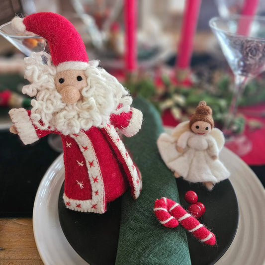 Close-up of Jolly Santa felt Christmas tree topper, red coat, wool beard