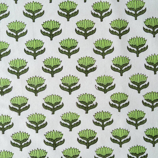 Close up of hand-block printed green lotus flower pattern on cotton napkin