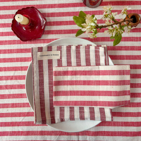 Close up of 100% cotton woven stripe napkins in poppy red and natural
