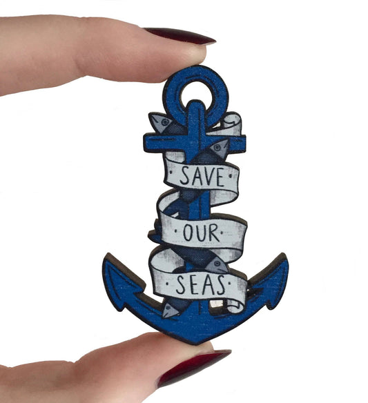 Nautical tattoo style anchor badge on illustrated backing card
