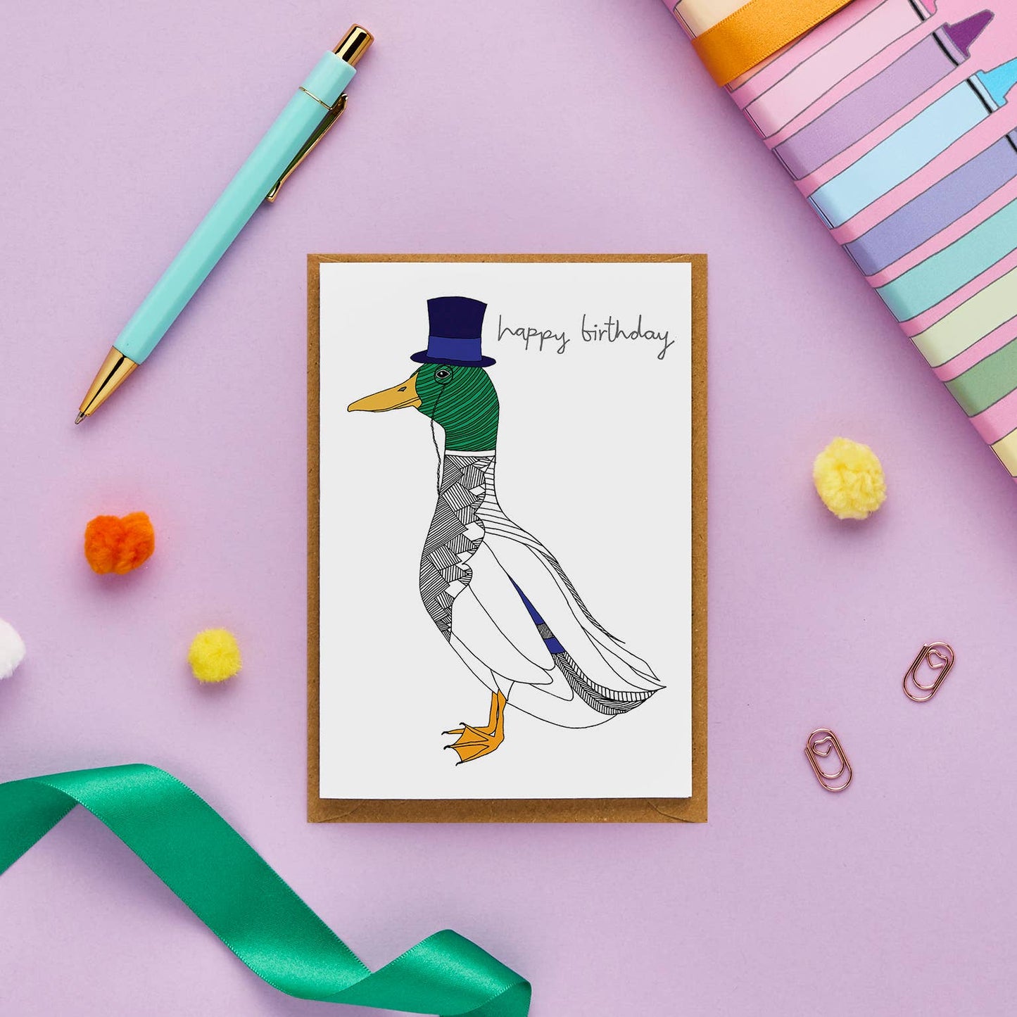 This charming birthday card, showcasing a dapper duck, is all set to kick off the celebrations in style. Featuring a hand-drawn illustration of a mallard duck sporting a top hat and an eye monocle, it’s the perfect way to send a sophisticated 'happy birthday' greeting.