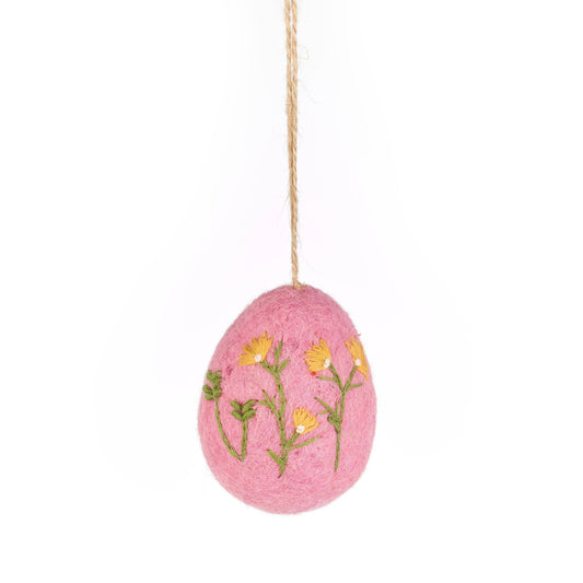 Pink handmade felt Easter egg with intricate floral embroidery, a charming sustainable decoration.